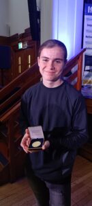 Callum holding his Jack Petchey Foundation Award